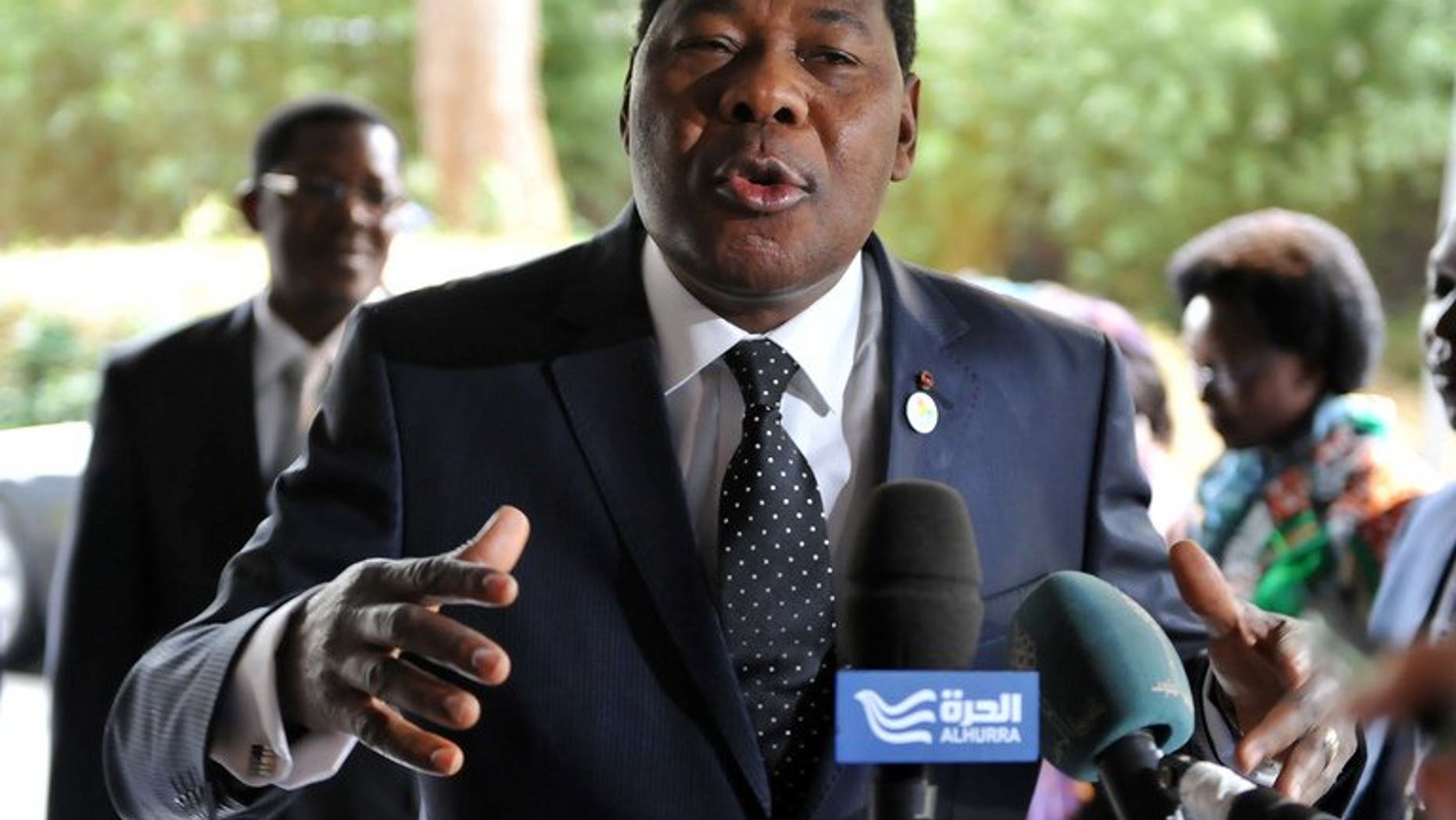 President of Benin, Thomas Boni Yayi, talks to the press on May 15, 2013 at EU headquarters in Brussels. His niece, his doctor and an ex-minister were accused of being part of a conspiracy to poison him by replacing his medicine.