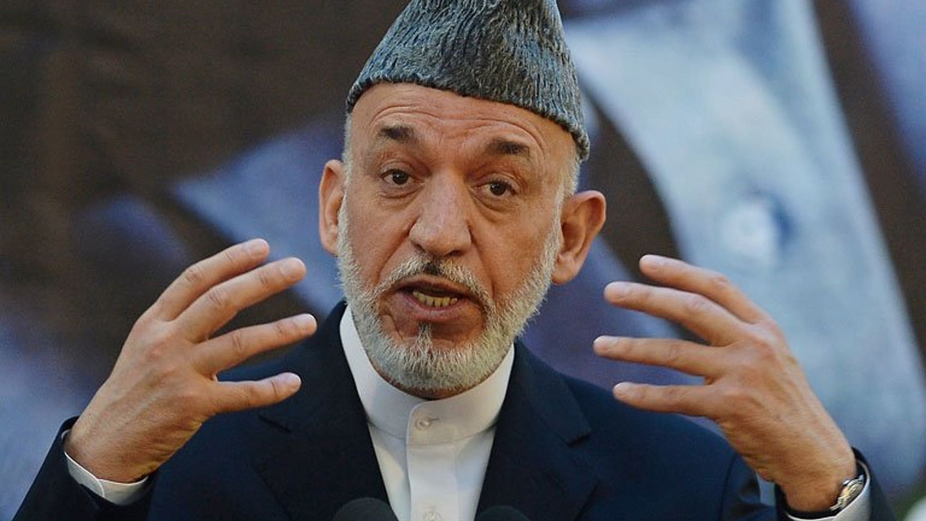Afghan President Hamid Karzai speaks during a joint press conference with NATO Secretary General Anders Fogh Rasmussen at a military academy outside Kabul on June 18, 2013. Karzai on Wednesday approved changes to the make-up of Afghanistan's electoral complaints watchdog, removing foreign UN representatives before presidential polls next year.
