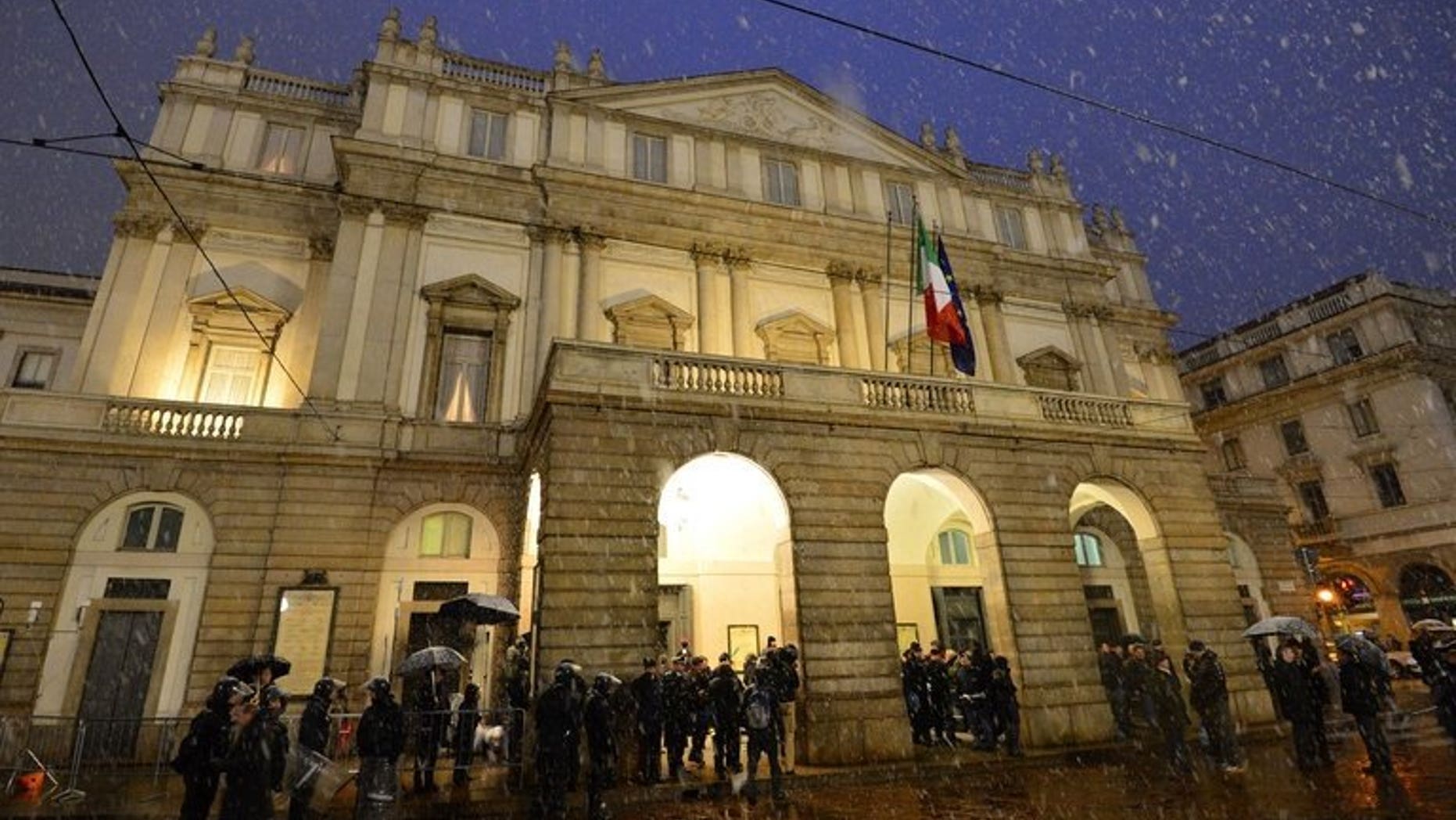 Guests arrive at the entrance of La Scala opera house on December 7, 2012 in Milan. Austrian musical director Alexander Pereira will take over at Italy's prestigious opera house in 2014, a year earlier than expected, the theatre said Wednesday.