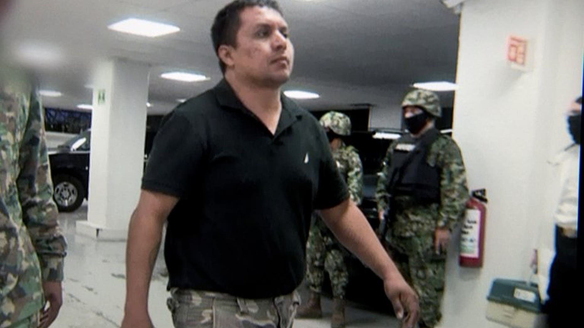 Picture taken from a video released by the Mexican Navy showing the captured head of the Zetas drug cartel Miguel Angel Trevino in Mexico City on July 16, 2013. Trevino has filed for legal protection over claims that he is at risk of torture or isolation during his detention, court officials said.