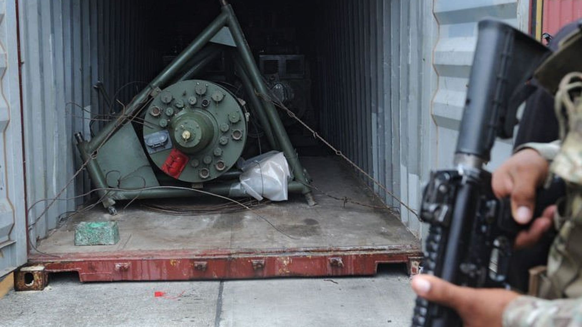 A Panamanian soldier guards a container on the North Korean ship Chong Chon Gang, in which Soviet-era weaponry was found, at Manzanillo Port in Colon, Panama, on July 17, 2013. North Korean sailors whose dilapidated ship was halted near the Panama Canal and found to be carrying the military equipment could face up to six years in jail, a prosecutor has said.