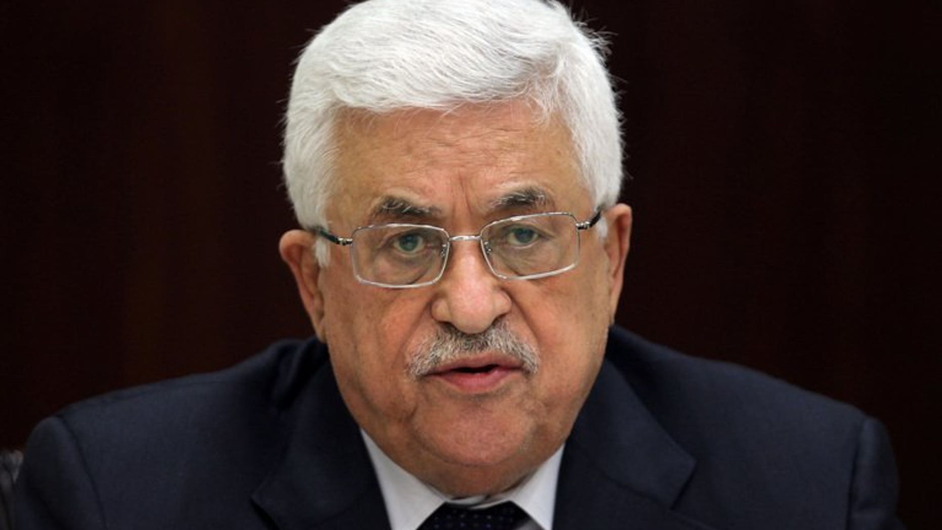 Palestinian president Mahmud Abbas chairs a meeting in Ramallah on May 12, 2013. Palestinian leaders will vote on a US plan under which peace talks with Israel will not depend on a settlement ban, a key Palestinian demand, a PLO official tells AFP.