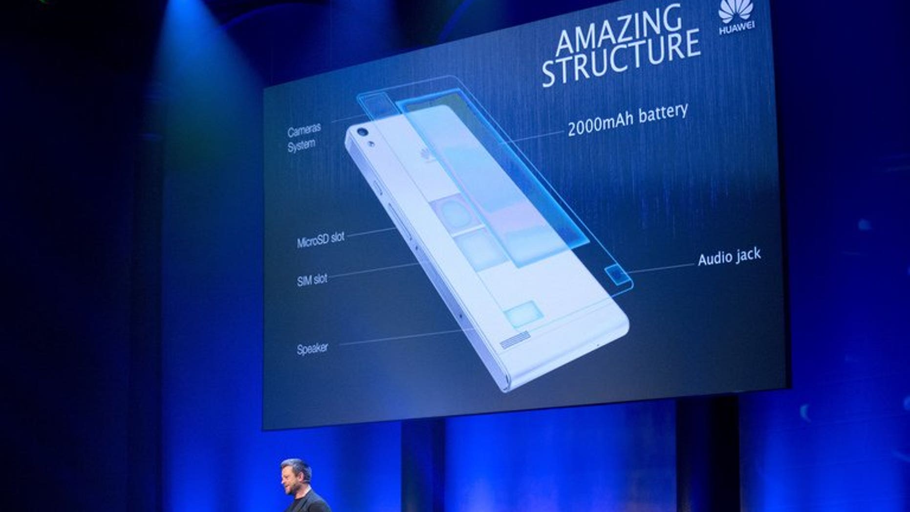 Nick Woodley, head designer of Huawei London, speaks during the global launch of the new Huawei Ascend P6 smartphone in London on June 18, 2013. The British government said Thursday it would look again at how it safeguards its telecommunications networks from feared security risks posed by the involvement of Chinese giant Huawei.