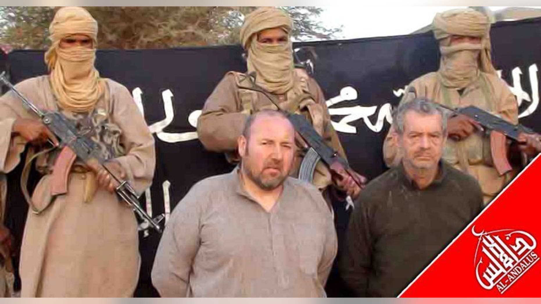 A picture released in December 2011 shows Philippe Verdon (right) and Serge Lazarevic at an undisclosed location. French hostage Verdon, who was kidnapped by Al-Qaeda in the Islamic Maghreb (AQIM) in Mali in 2011 and found dead several weeks ago, was executed with a shot to the head, prosecutors said Thursday