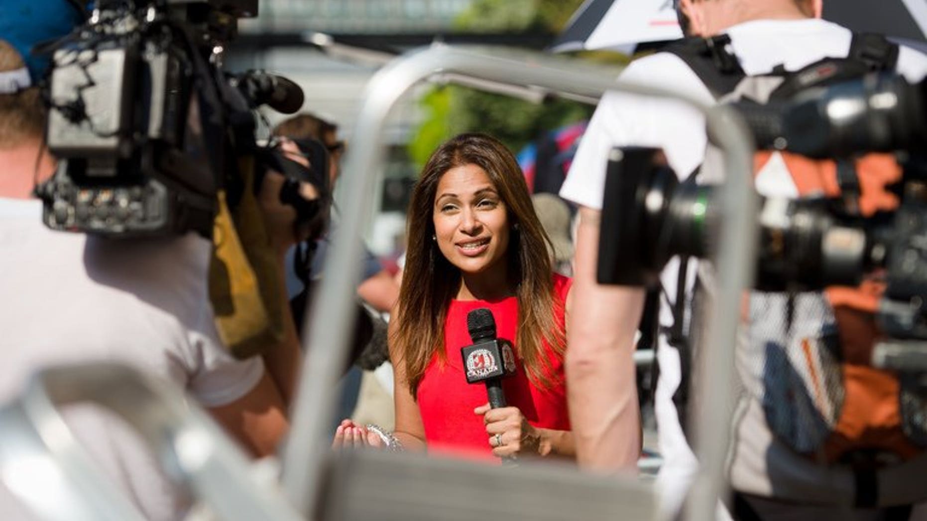 A television presenter records a piece to camera outside the Lindo Wing of St Mary's Hospital in London, on July 17, 2013. After more than two weeks camped outside St Mary's Hospital in London, the media waiting for Prince William's wife Catherine to give birth are having terrible thoughts -- what if they are in the wrong place?