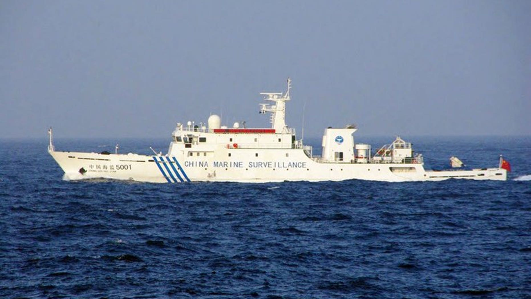 This handout picture taken by the Japan Coast Guard on June 27, 2013 shows a Chinese marine surveillance ship cruising near the disputed islets in the East China Sea. Three Chinese government ships sailed into waters around islands at the centre of a territorial dispute on Thursday, the day after Japan's premier visited coastguards who patrol the area.