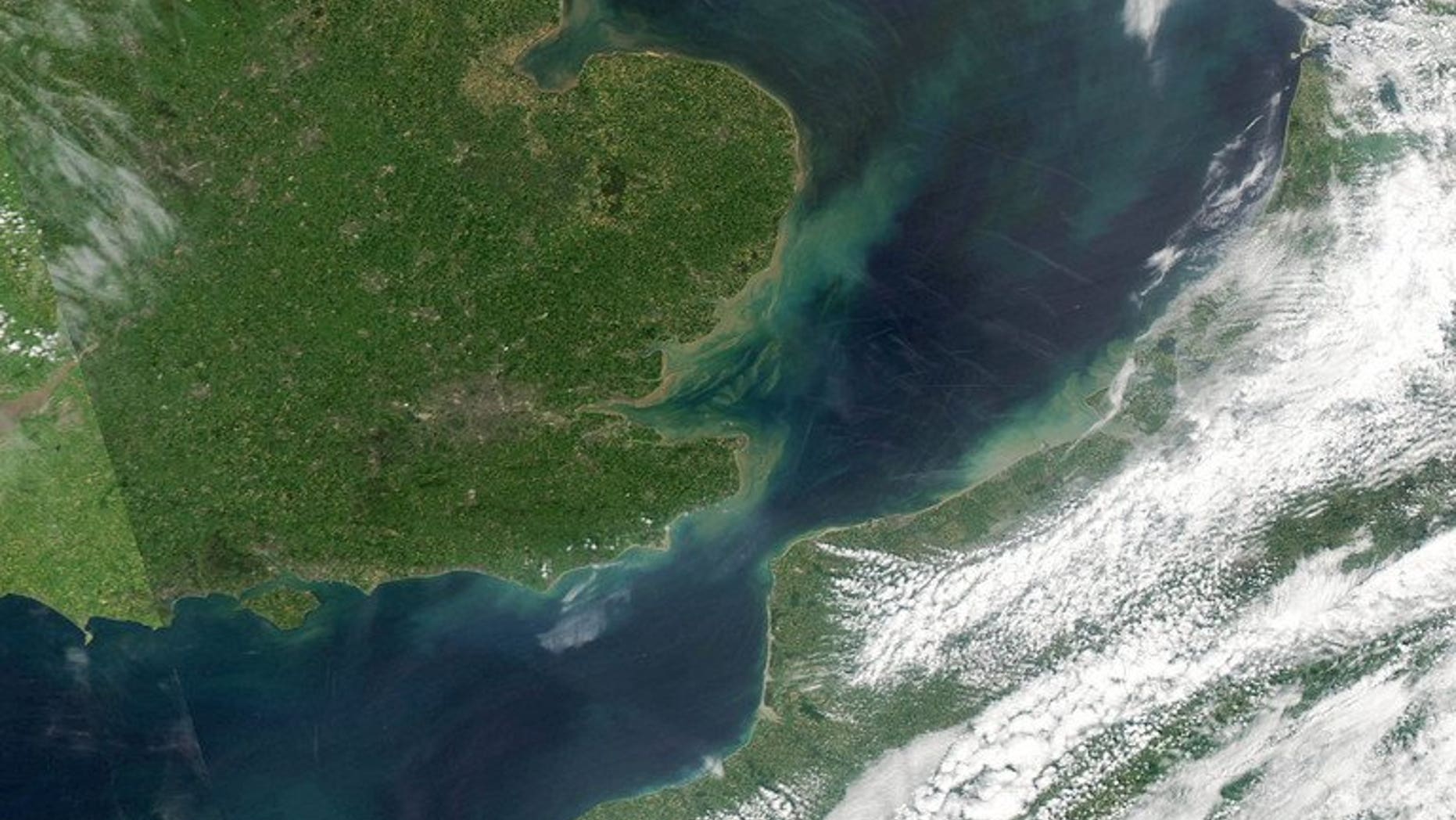 An image from the MODIS on the Aqua satellite shows parts of England (Upper-L) and France, separated from each other by the English Channel on June 3, 2006. A man who attempted a 500-kilometre (300-mile) journey from Britain to Ireland in a tiny blow-up beach dinghy was rescued after making it a short distance in the wrong direction, coastguards said Thursday.