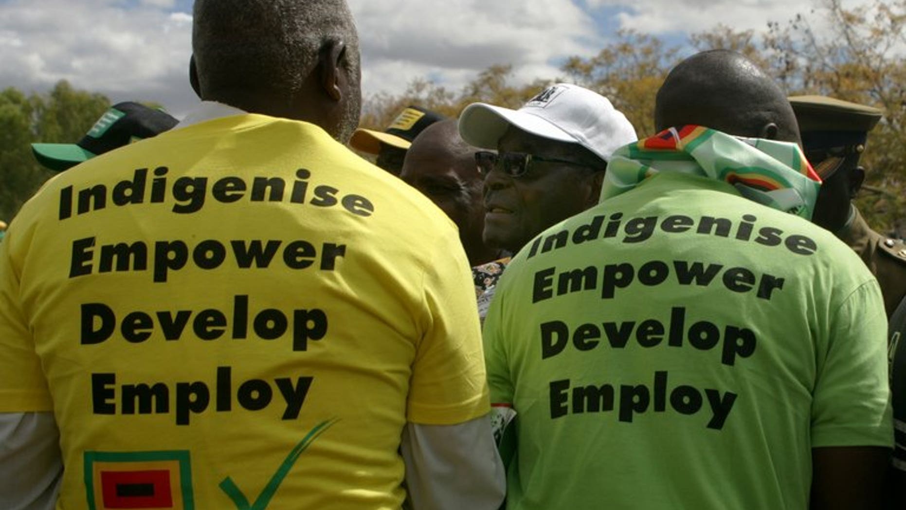 Zimbabwe President Robert Mugabe addresses an election campaign rally in Mashonaland Central province on July 11 2013. Mugabe on Thursday rebuked the "insane" US for criticising his push for elections without key reforms and told it to keep its "pink nose" out of Zimbabwe's affairs.