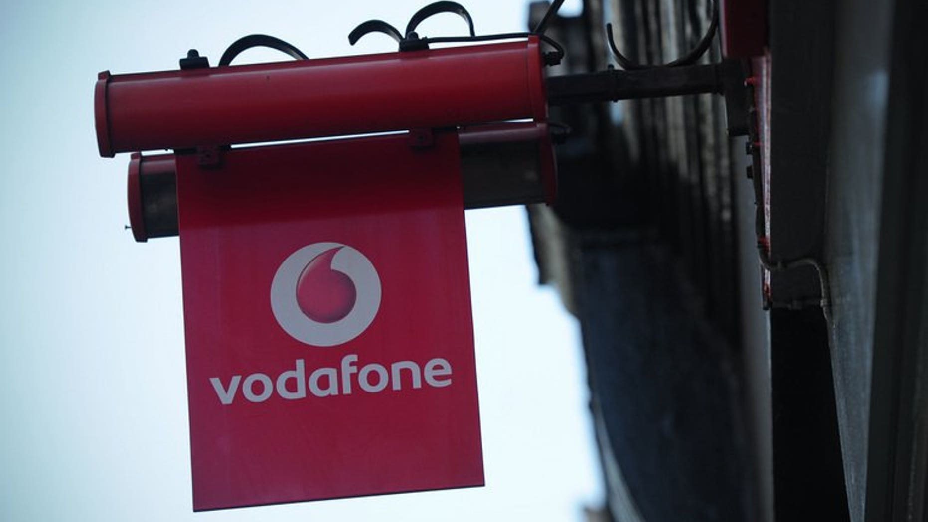 A sign outside a Vodafone shop in London. British mobile phone giant Vodafone said on Friday that sales grew in the first quarter, as strength in emerging markets countered weakness in Europe.