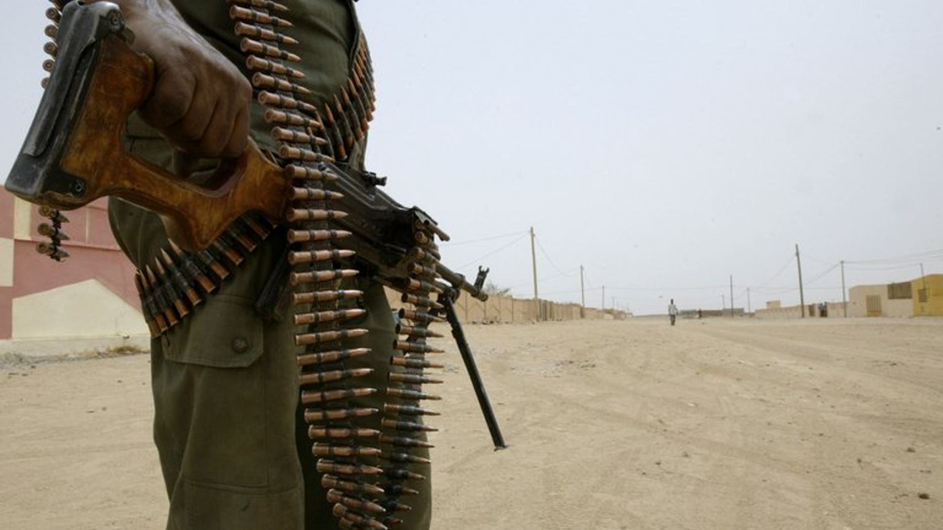 A Malian soldier partrols in the streets of Kidal on May 26, 2006. Clashes between Tuaregs and black Africans in the flashpoint northern city has left at least one dead overnight, officials said, a sign of growing tension with key polls nine days away.