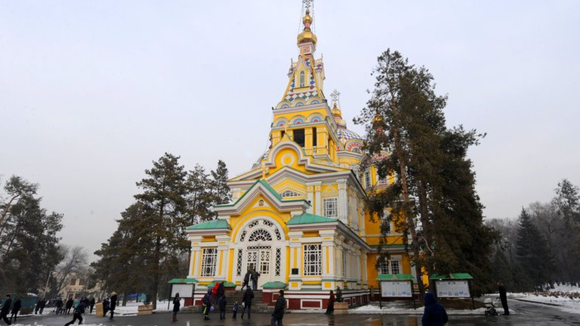 People walk in front of the Russian Orthodox Ascension Cathedral in Almaty on January 30, 2011. Kazakhstan has launched legal proceedings on suspicion of graft in a passport counterfeiting case against a wanted oligarch's wife who was expelled from Italy in May, officials said Friday.
