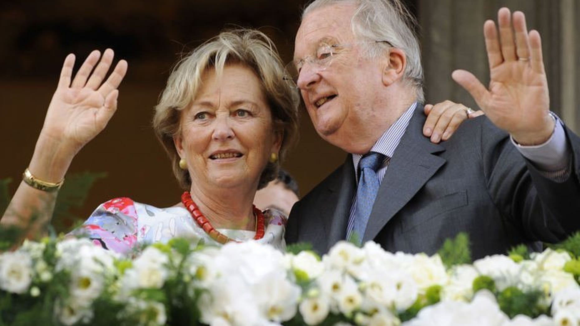 King Albert II of Belgium and Queen Paola wave to the crowd on July 19, 2013 during a visit in Eupen in Liege. The visit to the southern Belgian city was Albert's last in 20 years of a reign that comes to a close Sunday.