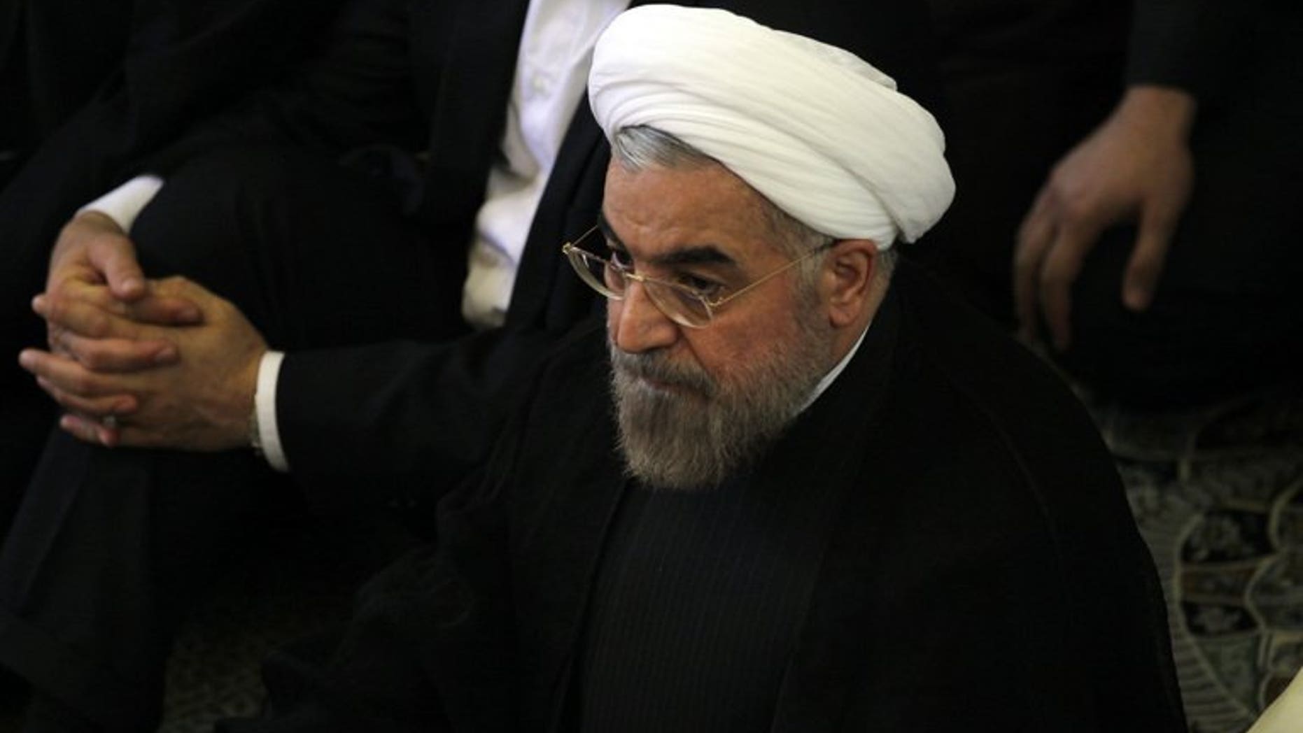 Iranian president-elect Hassan Rowhani (C) attends the Friday prayer on July 12, 2013 in Tehran. World powers hope his election as president of Iran will provide fresh impetus and "a change in tone" in ongoing talks on the country's controversial nuclear programme.