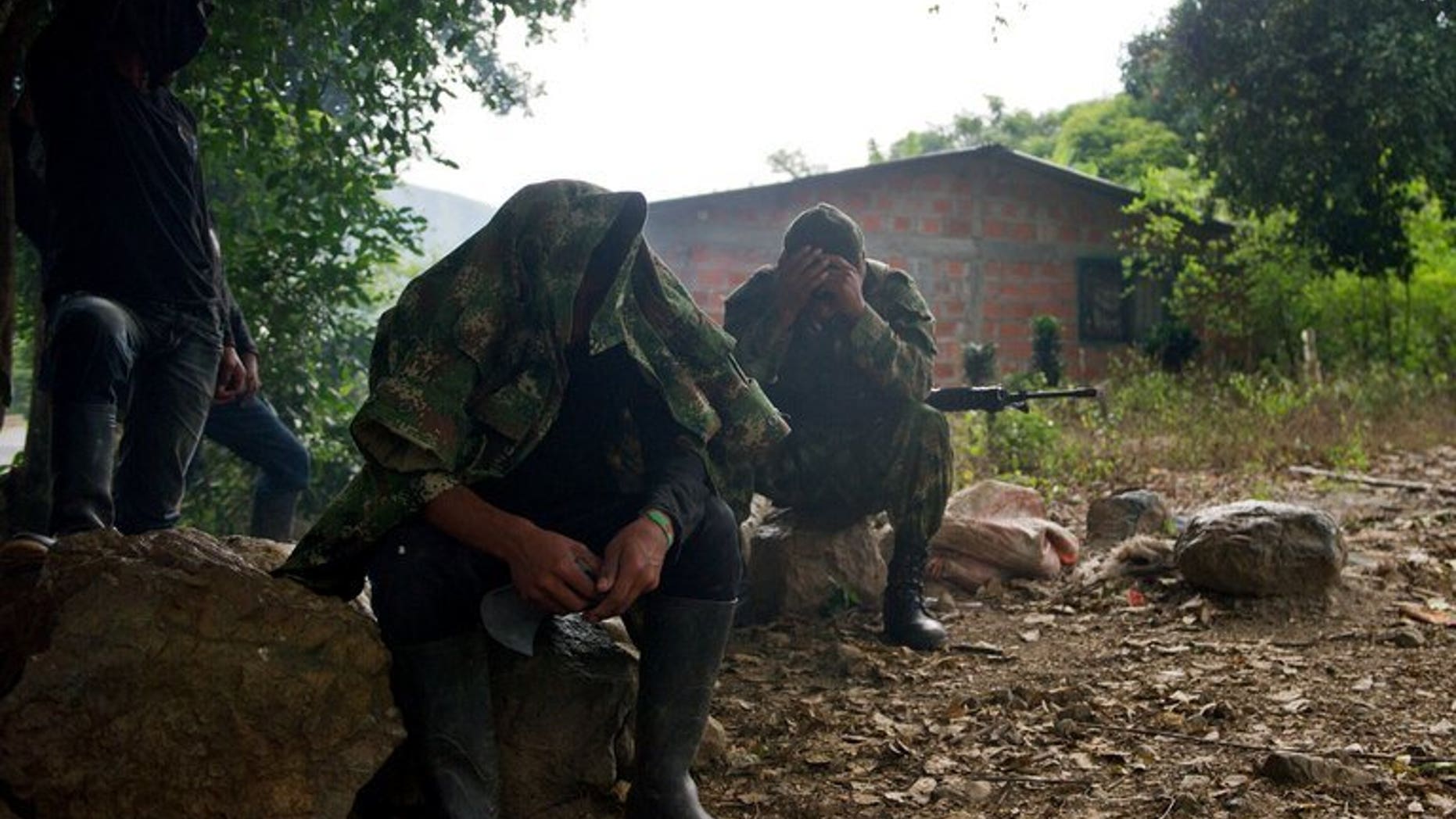 FARC guerrillas in the rural area of Caloto, Colombia, on June 4, 2013. The leftist rebels said they captured a US soldier last month and are offering his release as a "gesture" toward peace with Bogota.