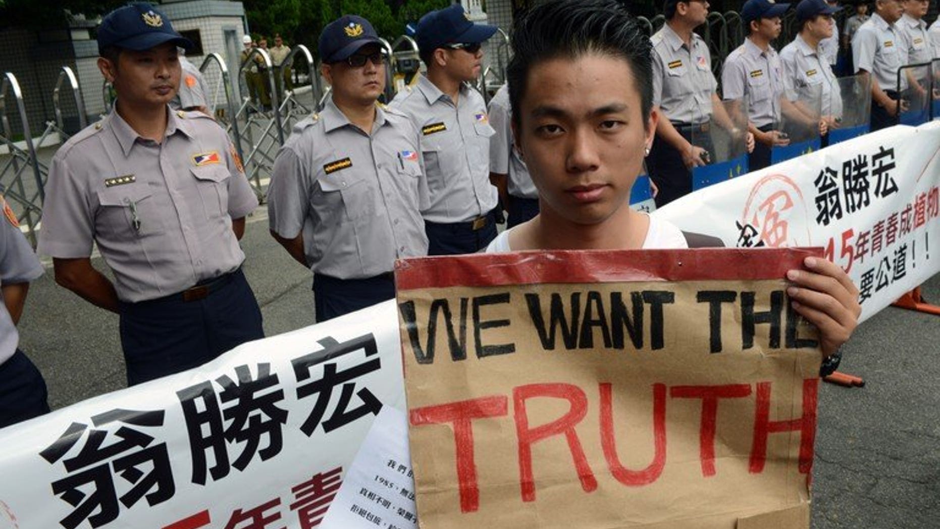 A protester during an anti-military rally outside the defence ministry in Taipei on July 20, 2013. Thousands of protesters demanded justice for a corporal who died after allegedly being abused in the military, in a case that sparked anger across Taiwan.