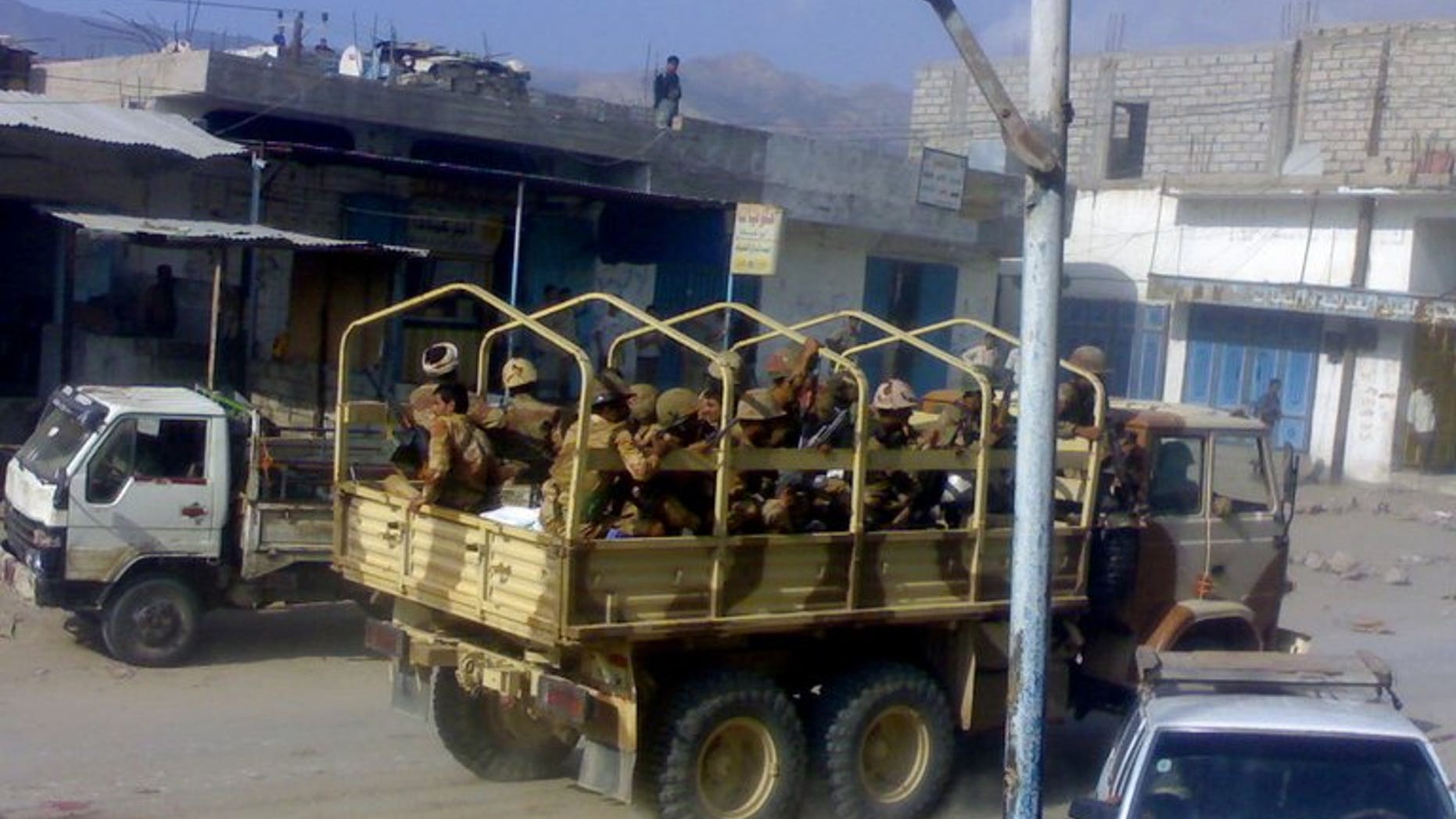 Yemeni troops patrol the town of Mudia in Abyan province, on October 17, 2010. Al-Qaeda suspects have shot dead a member of a pro-army militia that had backed a military offensive against the network in 2012, a police official tells AFP.
