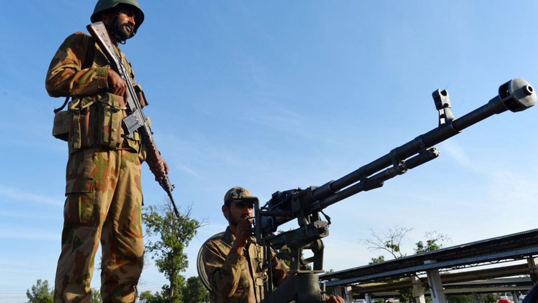 Pakistani troops patrol the streets of Nowshera, a district in the Khyber Pakhtunkhwa province, on May 9, 2013. Tribal elders and Islamic clerics in northwest Pakistan have barred women from shopping in bazaars without a male relative, elders and an official tell AFP.