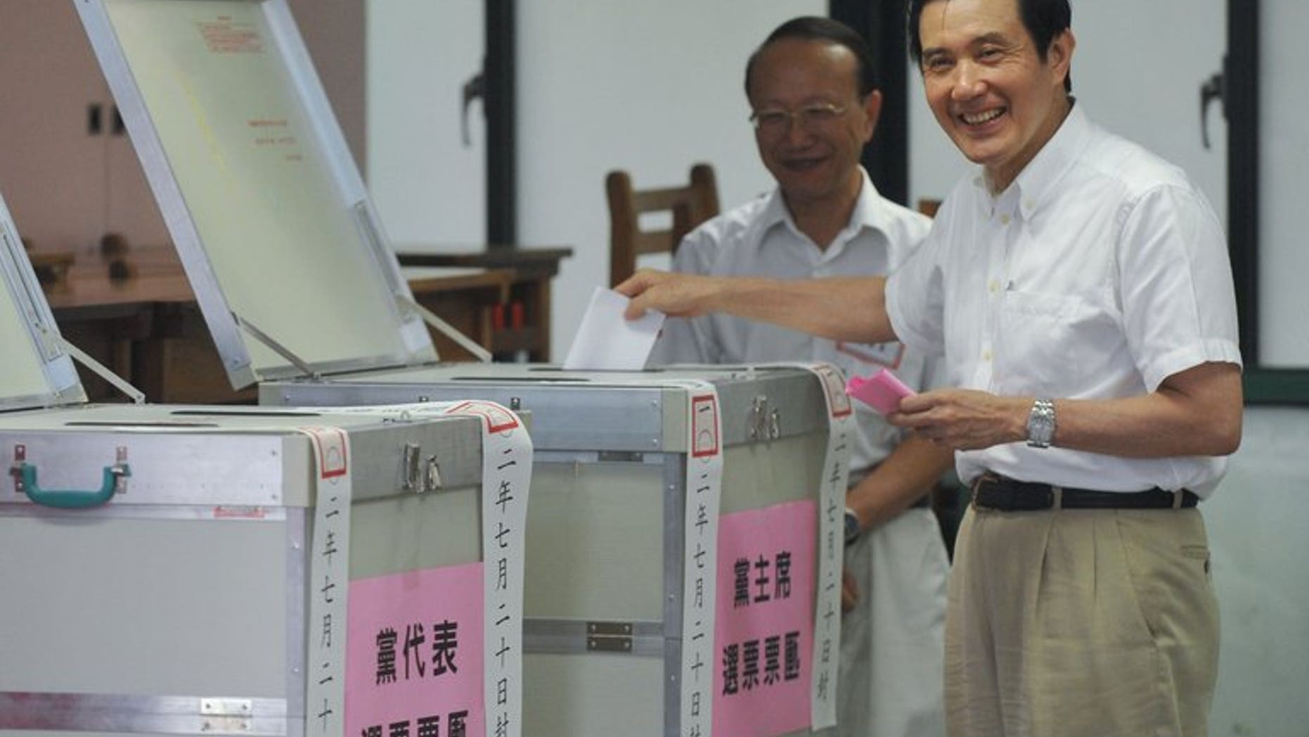 Taiwan President Ma Ying-jeou casts his ballot during an election for the ruling Kuomintang party in Taipei, on July 20, 2013. Ma has been overwhelmingly reelected chairman of the ruling party, amid corruption scandals involving top officials and public anger at his government.