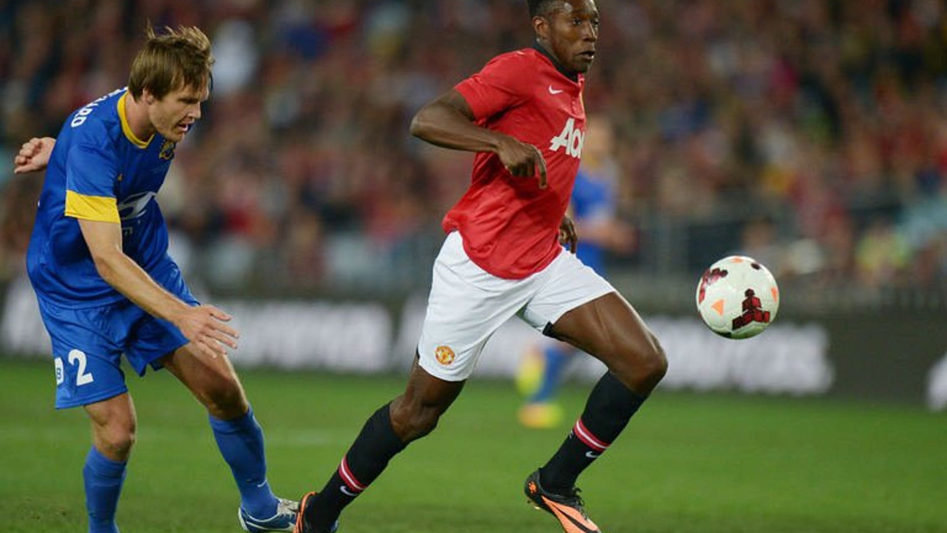 Danny Welbeck (right) of Manchester United football club breaks clear during the tour match against the Foxtel A-league Allstars in Sydney on July 20, 2013.