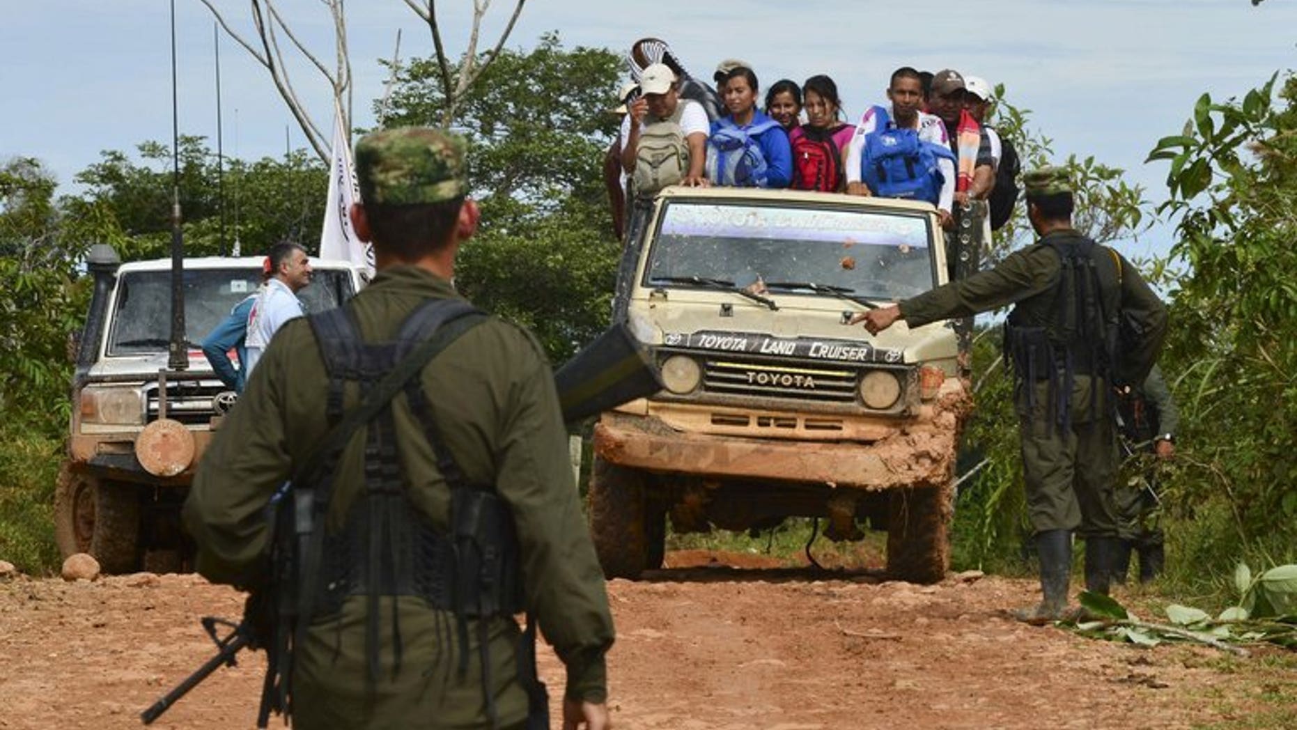 Revolutionary Armed Forces of Colombia (FARC) rebels set up a check-point near San Isidro, Caqueta, on May 30, 2012. Six guerrillas from the leftist FARC rebel group and four Colombian soldiers have been killed in clashes in southwest Colombia, the military said.