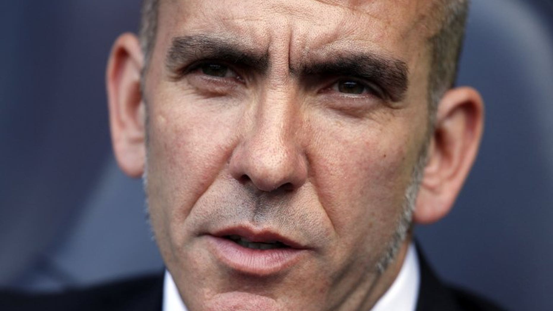 Sunderland's Italian manager Paolo Di Canio is seen at his team's match in London on May 19, 2013. Di Canio has joked he would have to cough up the cash to his players after threatening to fine them if they returned for pre-season overweight.
