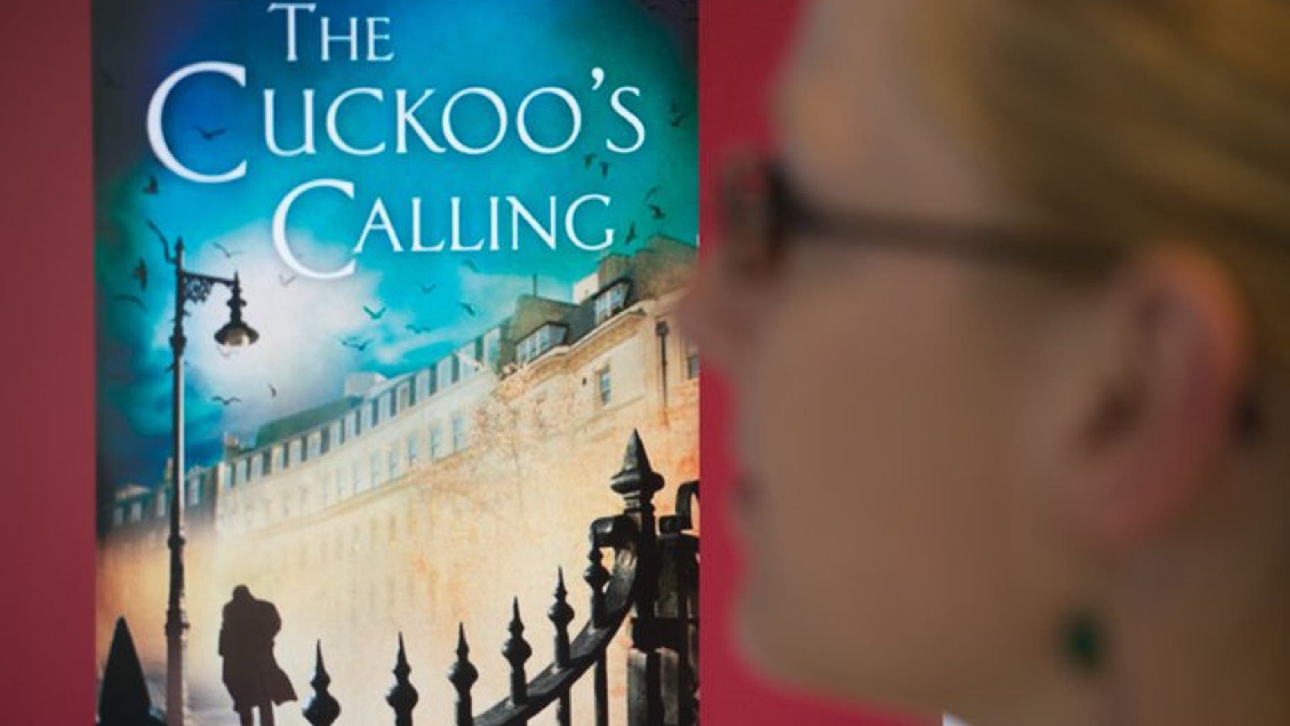 A woman looks at a screen showing the cover of a book written by J.K. Rowling under a psuedonym, July 15, 2013 in Berlin. The publisher who bought the German rights to a novel for a song before learning that the author was the Harry Potter writer says he was eyeing a windfall.