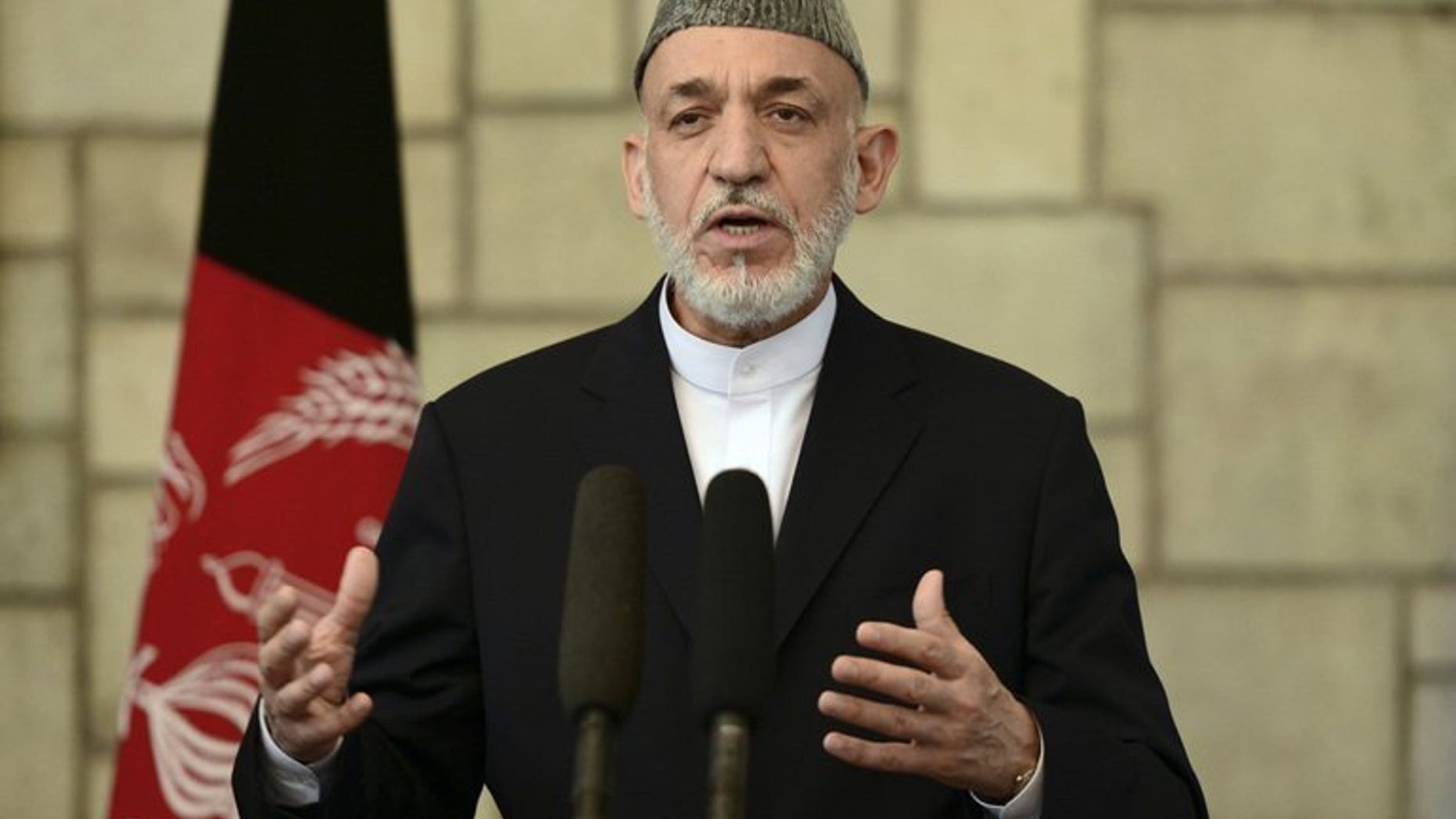 Afghan President Hamid Karzai speaks at a press conference in Kabul, on June 29, 2013. A senior Pakistani official has flown to Kabul, inviting Karzai to Islamabad as part of a charm offensive designed to improve strained relations and help peace efforts with the Taliban.