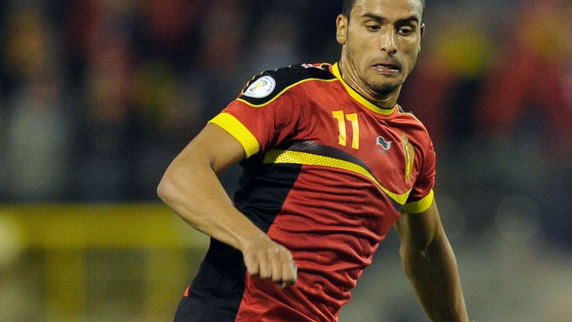 Belgium national football team's Nacer Chadli runs with the ball during the 2014 World Cup qualifying football match in Brussels on October 16, 2012. Tottenham are set to sign the FC Twente winger after agreeing a fee for the Belgian international.