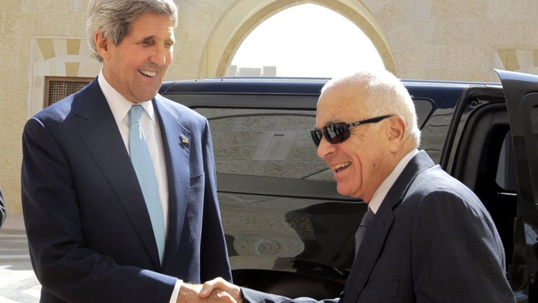 US Secretary of State John Kerry (left) shakes hands with Arab League chief Nabil el-Araby ahead of talks at the Hummar Palace in Amman, on July 17, 2013. The Arab League says it supports the Palestinian stance on the announcement of resumed peace talks with Israel, but that it was sceptical of Israeli intentions.