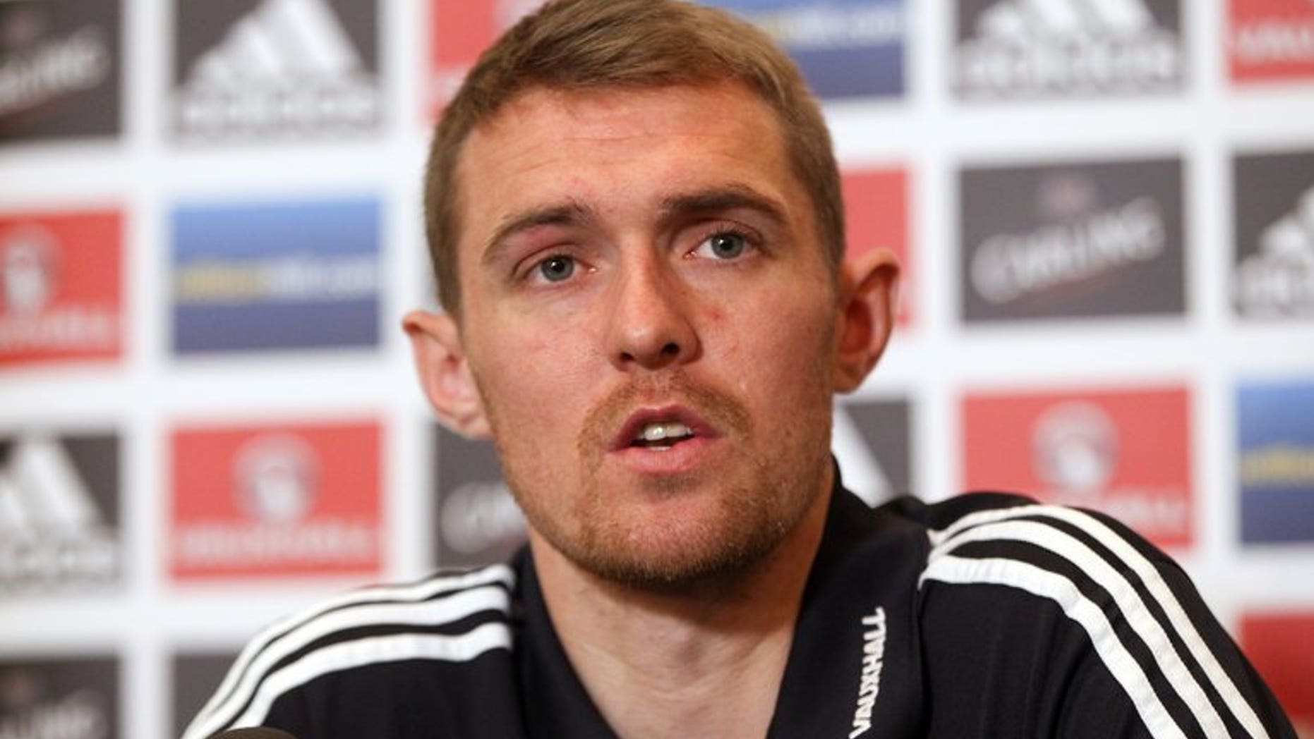 Darren Fletcher speaks during a press conference in Brussels on October 15, 2012. Manchester United midfielder Fletcher admitted on Sunday that he will miss the start of his side's Premier League title defence as he continues to recover from a bowel operation.