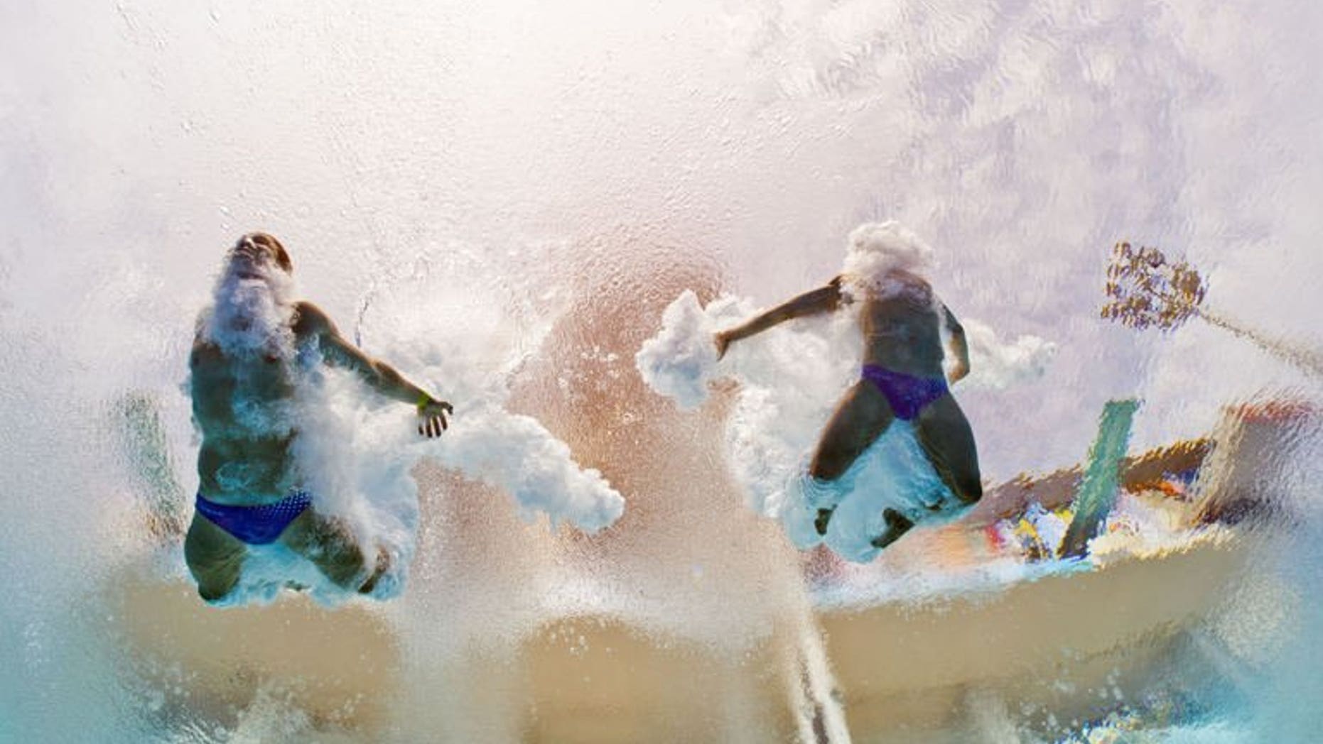 In a picture taken with an underwater camera Germany's Sascha Klein and Patrick Hausding compete in the men's 10-metre synchro platform preliminary diving event in the FINA World Championships at the Piscina Municipal de Montjuic in Barcelona on July 21, 2013.