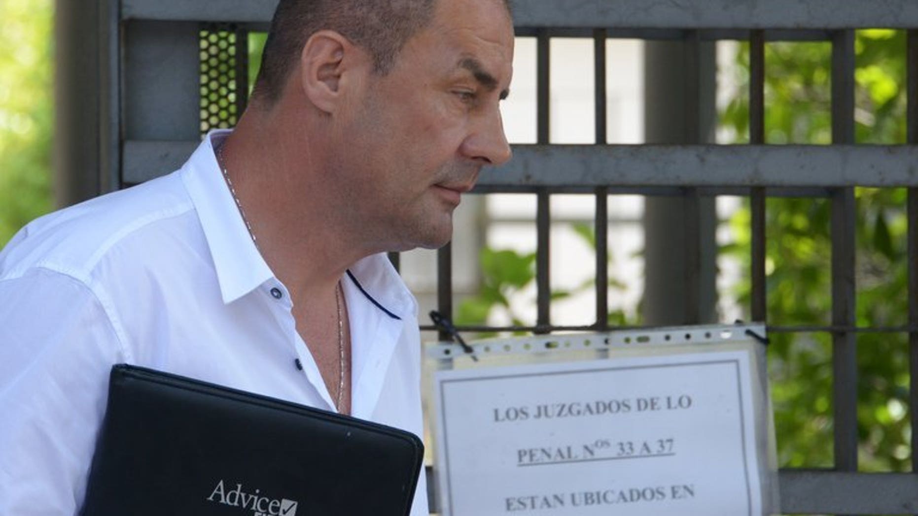 John Tomic, the father and coach of Australian tennis player Bernard Tomic, leaves the courthouse of Madrid after his trial on July 22, 2013. Tomic appeared in a Madrid court on Monday over the alleged assault of his son's training partner Thomas Drouet.