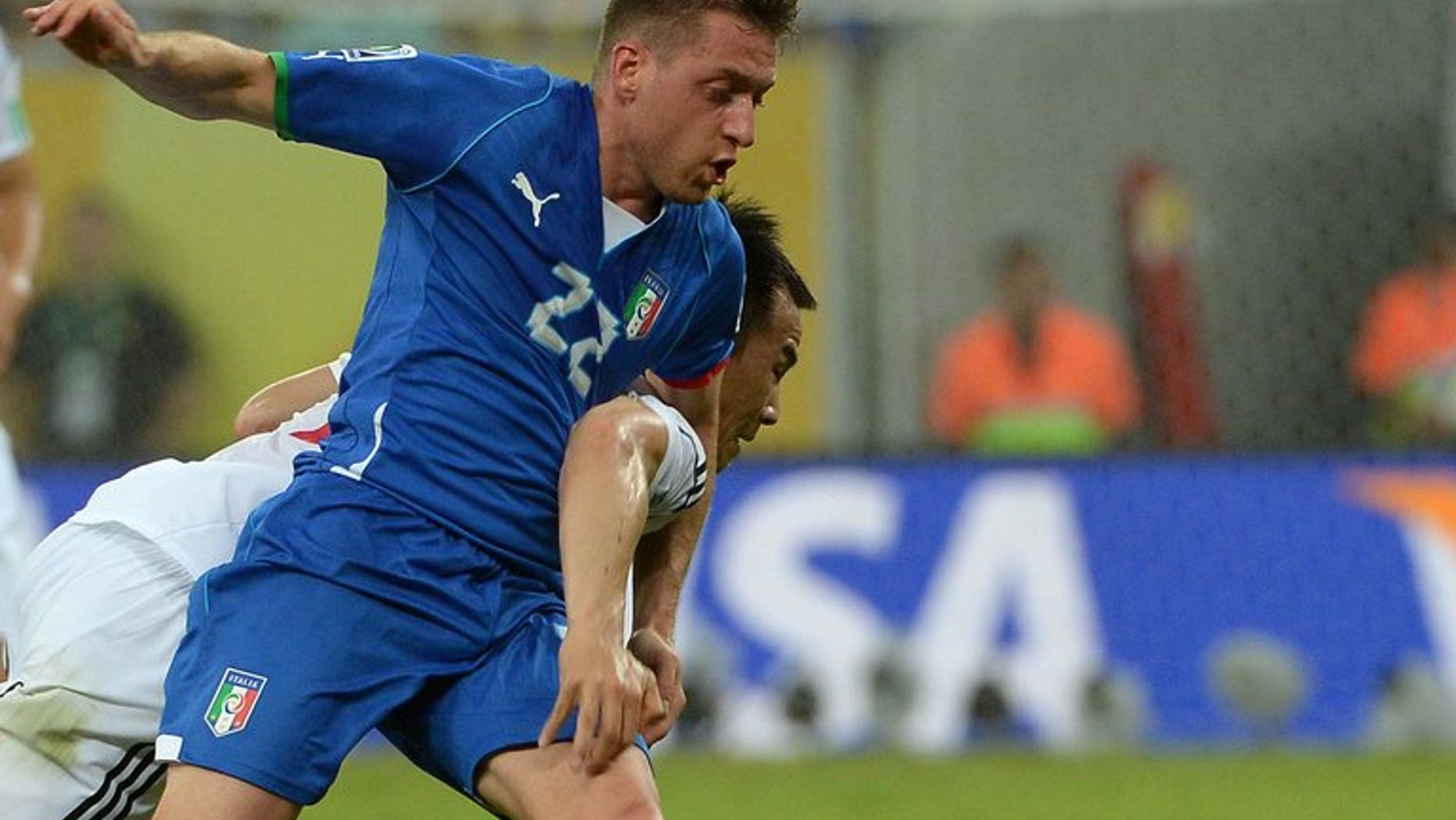 Emanuele Giaccherini (front) fights for the ball during a FIFA Confederations Cup match, in Recife, Brazil, on June 19, 2013. Sunderland manager Paolo Di Canio has lavished praise on new signing Giaccherini, calling him one of the best players in Europe.
