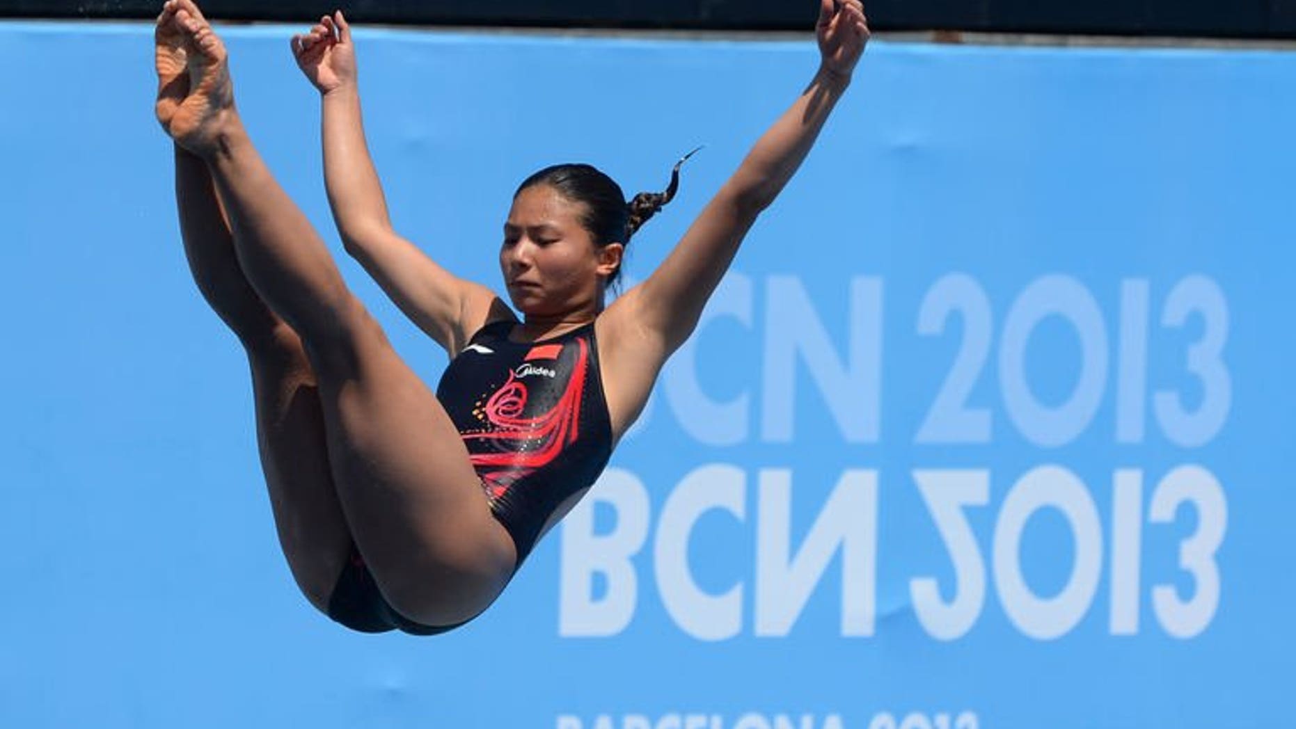 Chinese diver He Zi competes in the women's 1m springboard final at the FINA World Championships in Barcelona on July 23, 2013. He won gold by the finest of margins as she edged out Italy's Tania Cagnotto by just one tenth of a point.