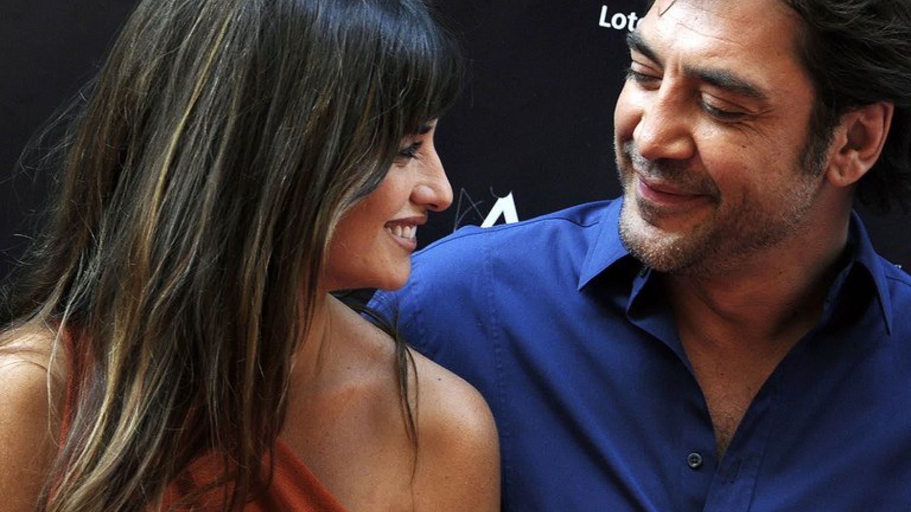 Spanish actress Penelope Cruz talks with her husband, Spanish actor Javier Bardem in Madrid on June 27, 2011. The Oscar-winning Spanish film stars had their second child--a girl according to Spanish media reports.