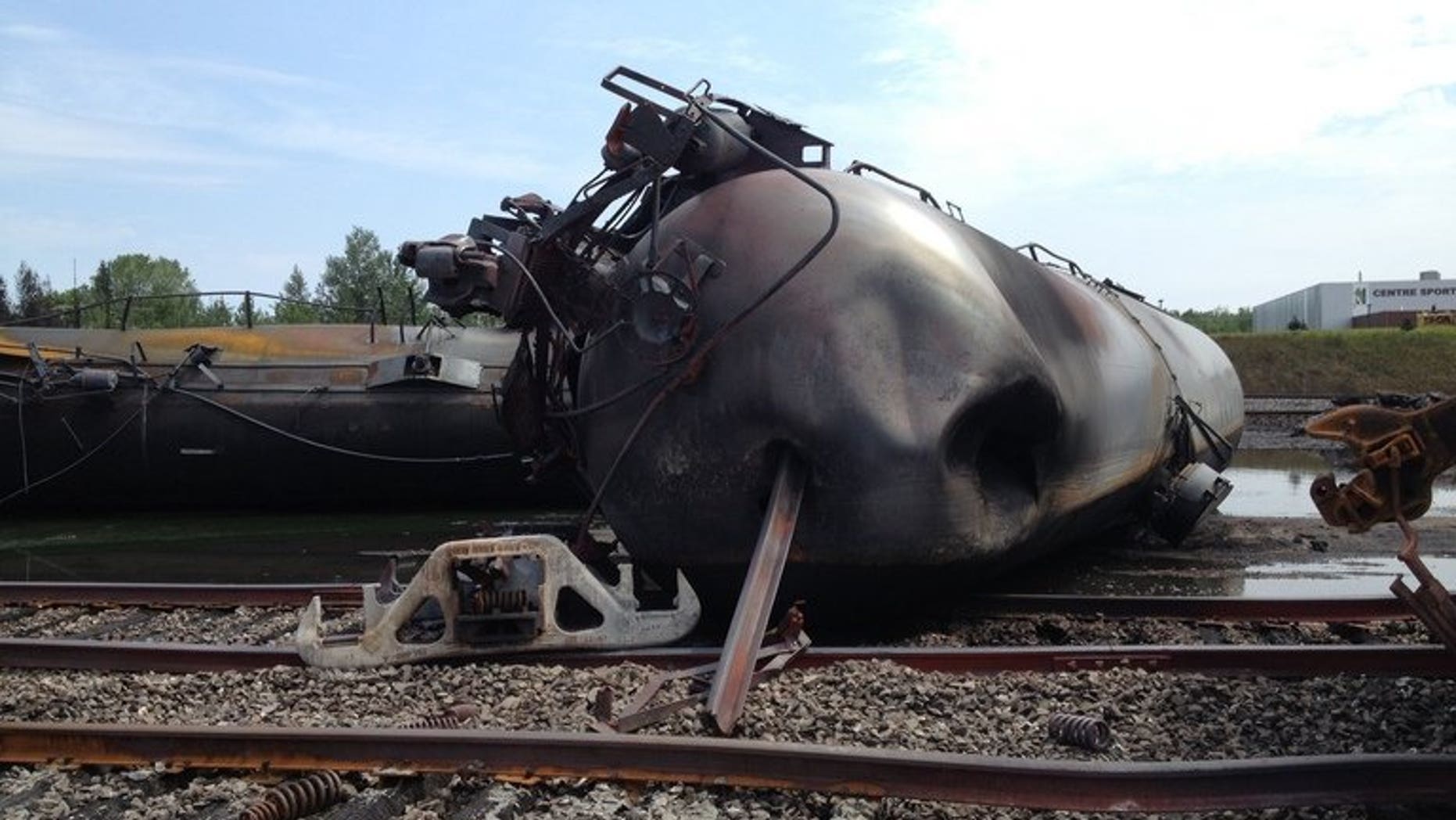 This July 8, 2013 handout image provided by the Transportation Safety Board of Canada, shows the aftermath of a train that derailed and exploded into a wall of flames in Lac-M??gantic, Quebec, Canada. Following a probe, Transport Canada requires railroads to follow several recommendations.