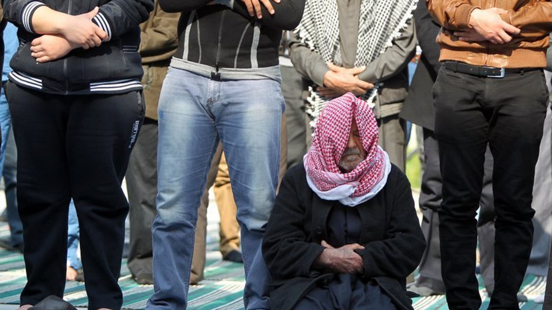 Iraqi Sunni Muslim men attend Friday prayers at the Abu Hanifa mosque in Baghdad's Adhamiya district on February 8, 2013. Bombs targeting worshippers gathered for evening prayers at three Sunni mosques in Iraq killed nine people on Tuesday, officials say.