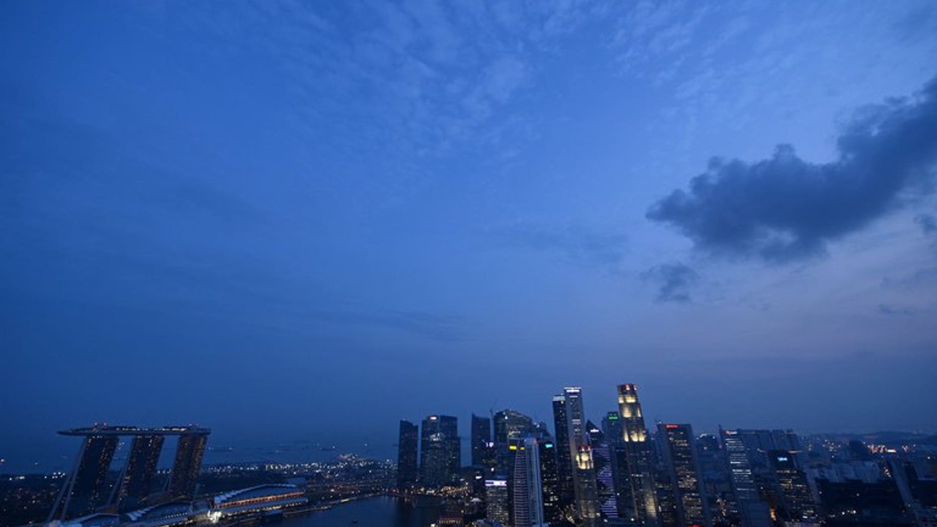 The sun sets over the Singapore skyline on September 17, 2012. A Singapore court on Wednesday charged a senior anti-corruption official with siphoning off more than a million dollars of government money to fund his casino gambling habit.