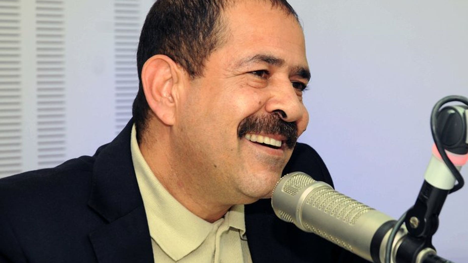 A picture taken on November 20, 2012 shows late Tunisian lawyer Chokri Belaid speaking during a radio interview in Tunis. Six people believed to have orchestrated the killing of an opposition figure whose assassination in February plunged Tunisia into a major political crisis have been identified, a minister said Wednesday.