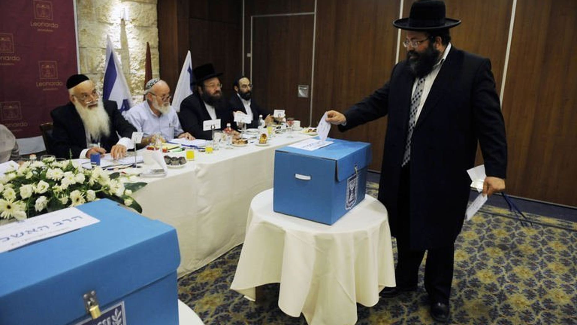 An ultra-orthodox Jew casts his ballot during the election for Israel's two chief rabbis held in Jerusalem on July 24, 2013. Two rabbis backed by ultra-orthodox parties were elected on Wednesday to serve as Israel's chief rabbis for the next 10 years, an official announcement says.