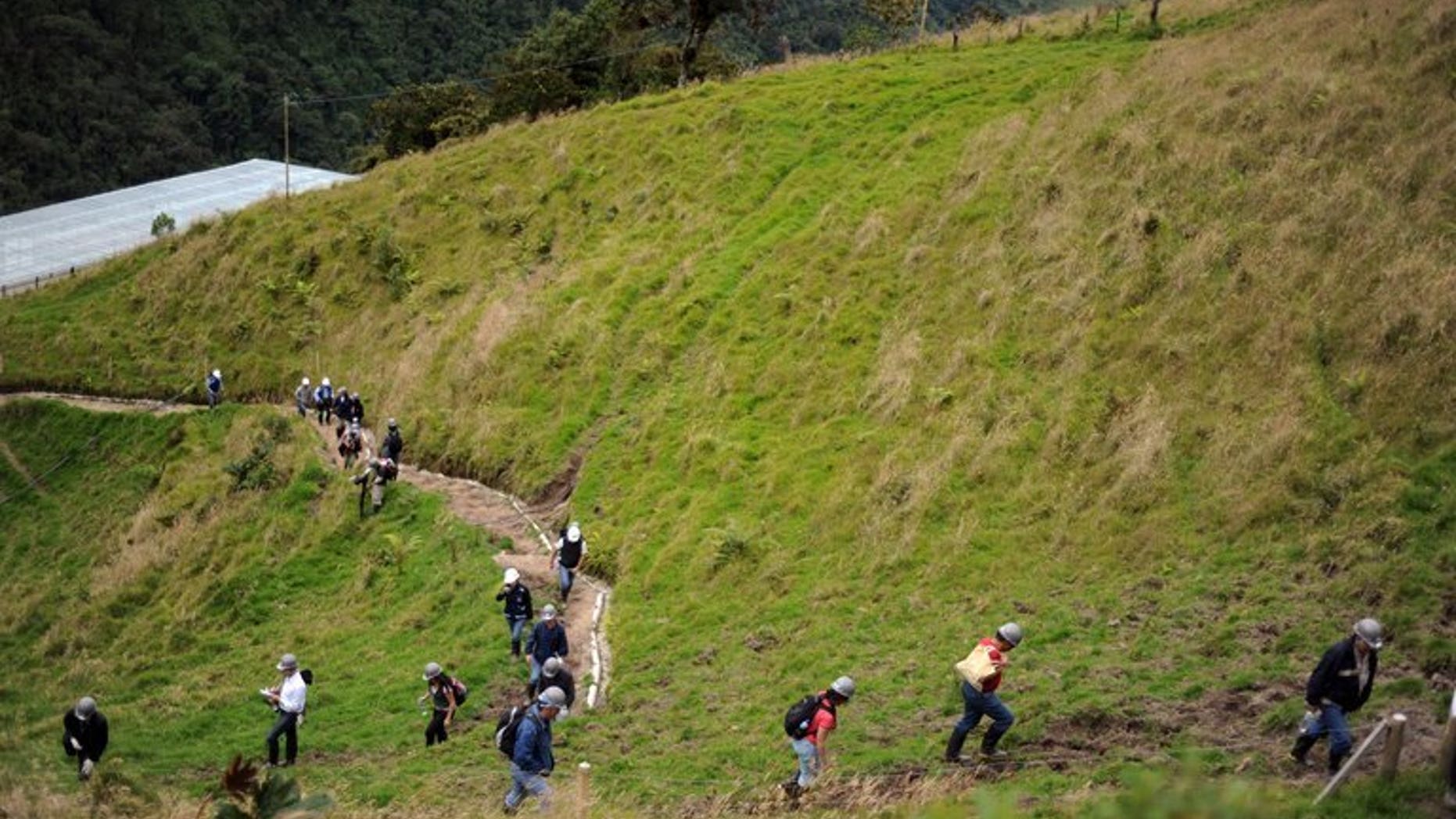 Visitors tour La Colosa gold deposit in Cajamarca, Colombia on August 28, 2009. A Canadian gold exploration company has abandoned its rights to a mining area in northern Colombia where one of its engineers was kidnapped by rebels.
