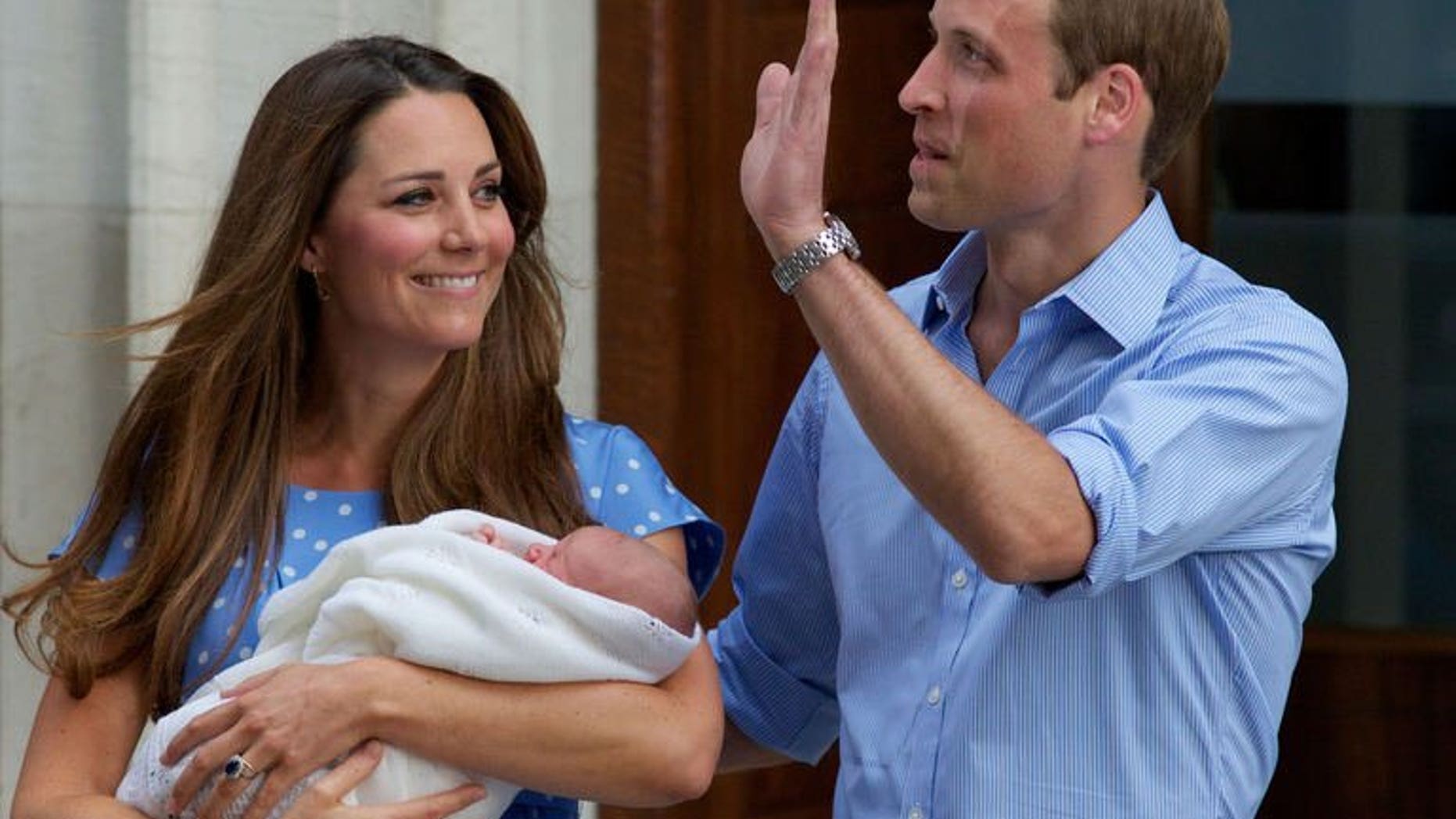 Prince William and Catherine, Duchess of Cambridge show their new-born baby boy to the world's media, standing on the steps outside the Lindo Wing of St Mary's Hospital in London on July 23, 2013.