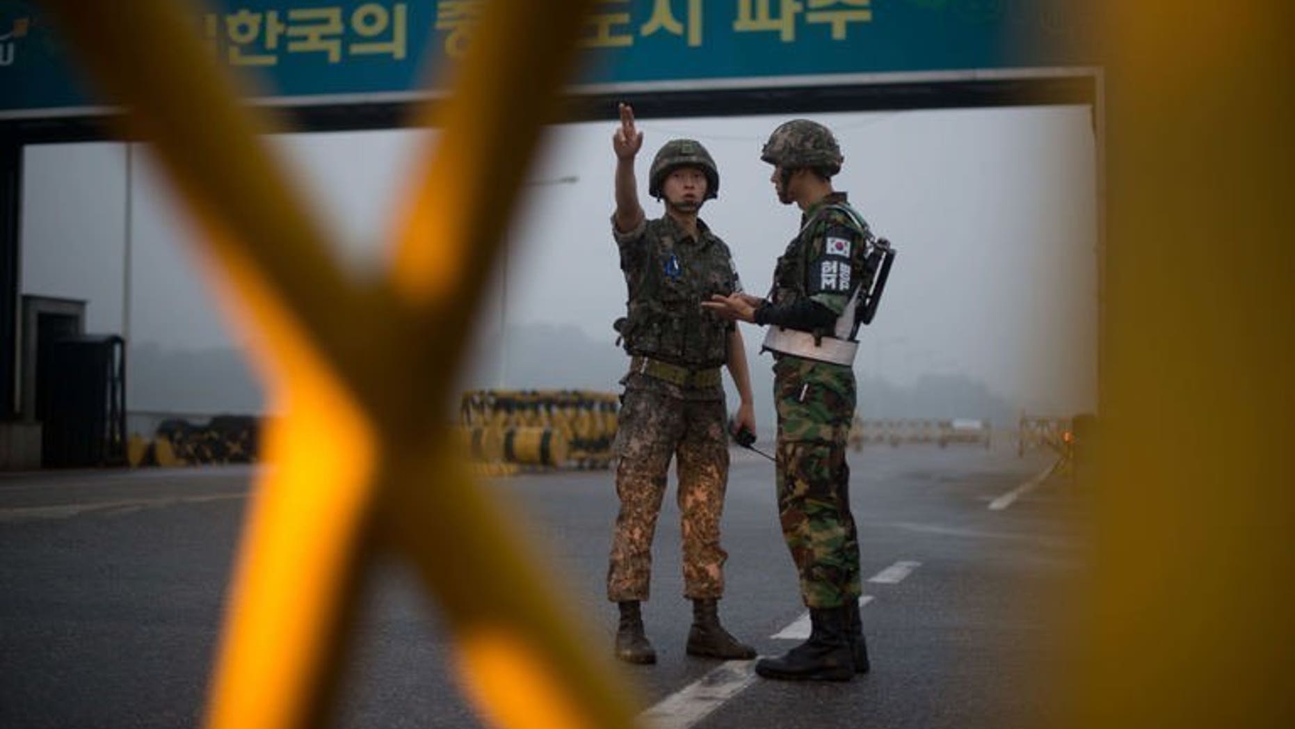 South Korean soldiers stand at a military checkpoint leading to the Kaesong joint industrial complex in North Korea on July 10, 2013. North and South Korea will hold fresh talks Thursday on reopening a joint industrial zone amid growing concern that the last symbol of peace between the two countries might be heading for a permanent closure.