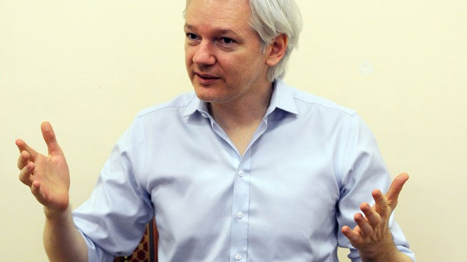 Wikileaks founder Julian Assange speaks to the media inside the Ecuadorian Embassy in London on June 14, 2013. Assange Thursday officially launched his political party to contest Australian elections this year, saying a victory for this candidates would be akin to planting the country's "best investigative journalists" in the Senate.