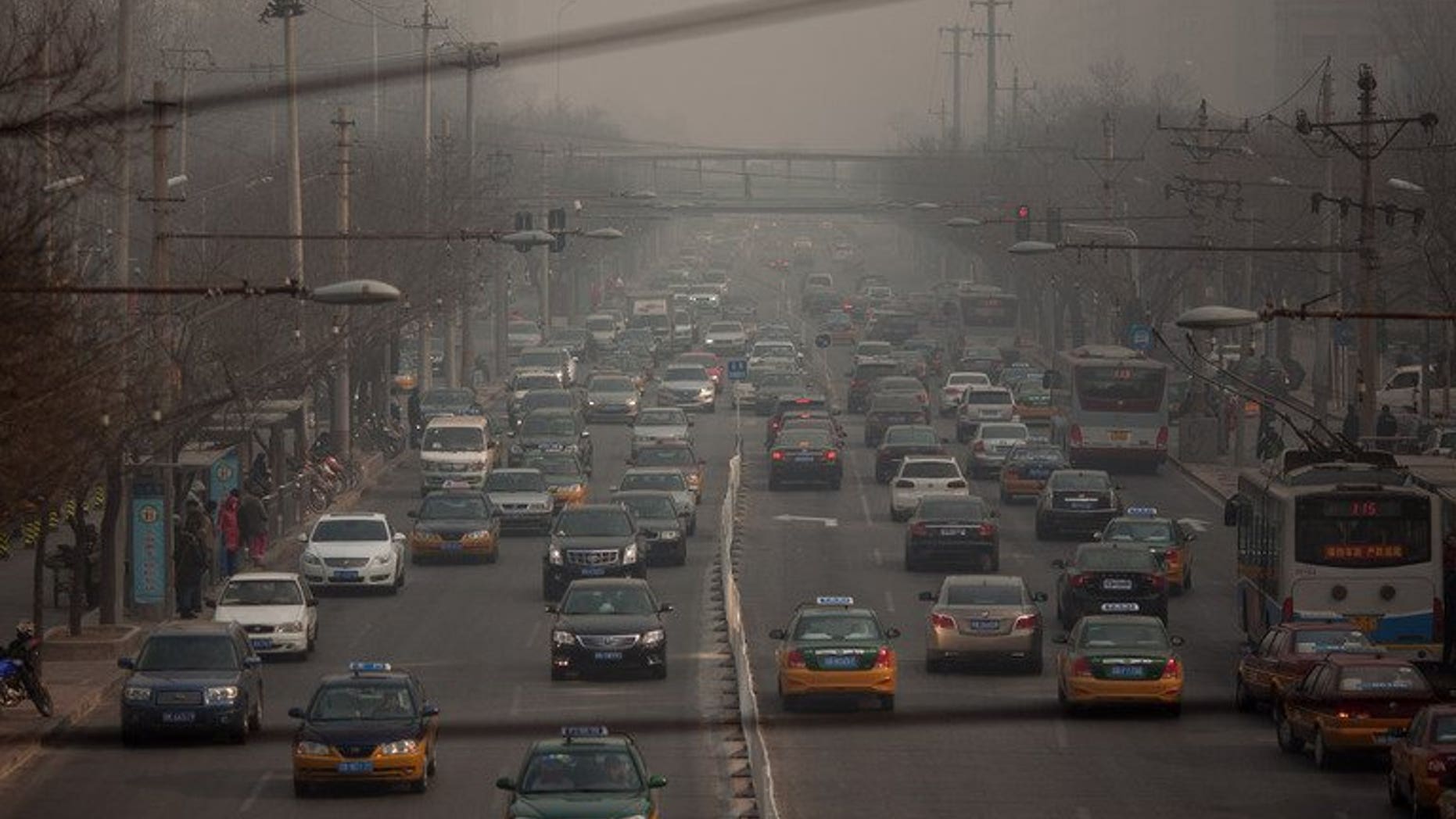 Traffic makes its way through Beijing on January 12, 2013. A Chinese man threw a two-year-old girl to the ground, killing her, after her mother apparently refused to make way for him to park his car, state media reported Thursday.