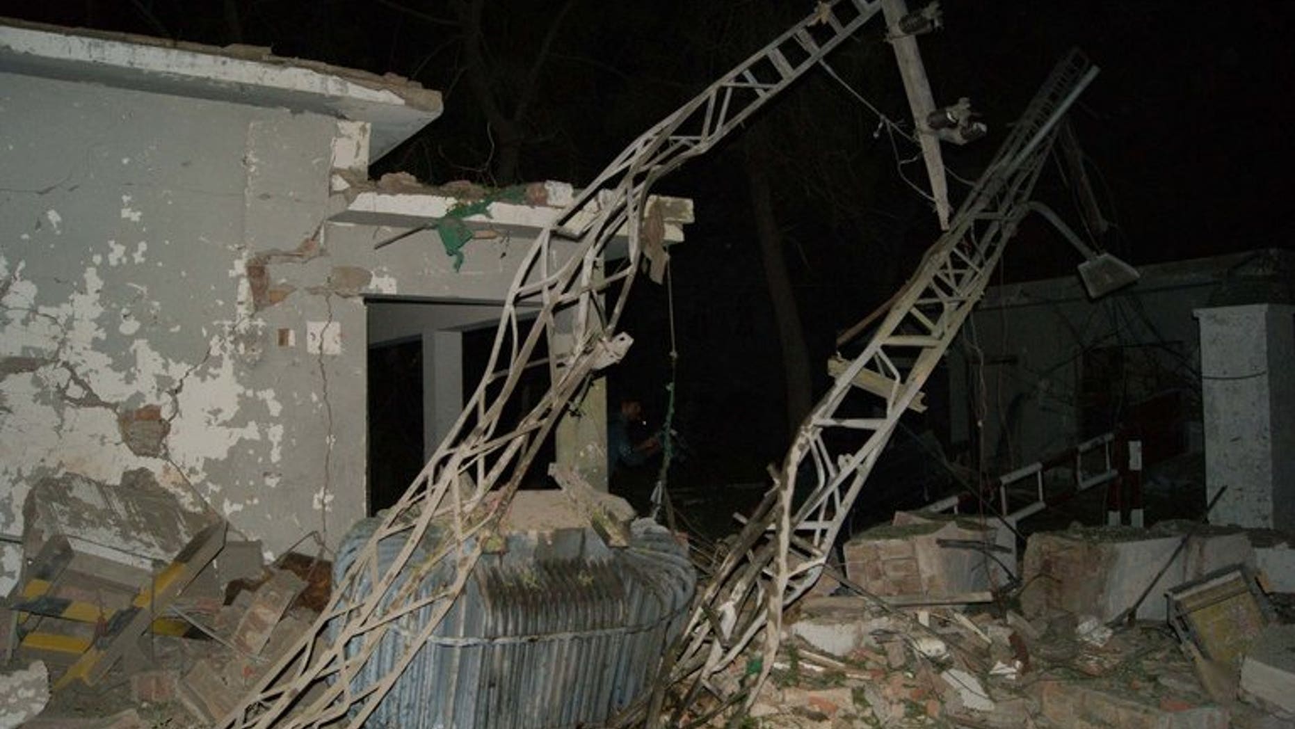 A damaged building is pictured at the site of suicide car bombing in the southern city of Sukkur on July 24, 2013. The death toll has risen to nine.