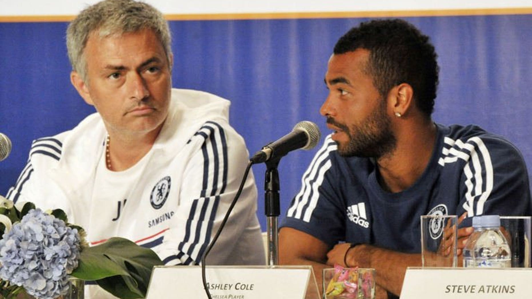 Chelsea football club manager Jose Mourinho (L) listens as player Ashley Cole (R) speaks during a press conference at a hotel in Jakarta on July 23, 2013. Chelsea turned on the style in an 8-1 rout of Indonesia All-Stars Thursday as they completed their Asian tour with a 100 percent record under returning manager Mourinho.