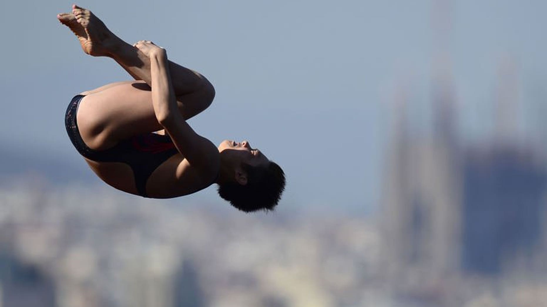 China's Si Yajie competes in the women's 10-metre platform final diving event in the FINA World Championships at the Piscina Municipal de Montjuic in Barcelona on July 25, 2013. Fourteen-year-old Si won the women's world 10m platform gold on Thursday with compatriot Chen Ruolin, the previous world and Olympic champion, in silver and Ukraine's Iulia Prokopchuk third.