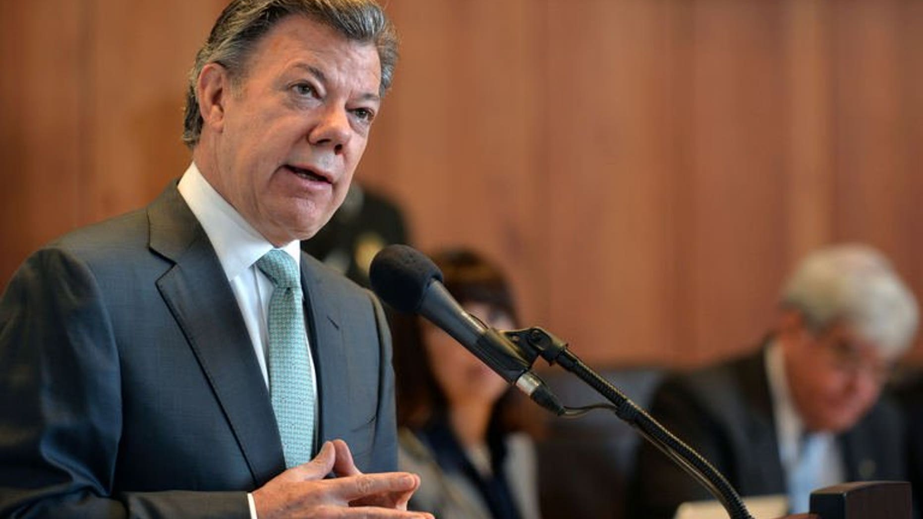 Handout picture released by the Colombian Presidency showing Colombia's President Juan Manuel Santos delivering a speech at the Constitutional Court in Bogota, Colombia, on July 25, 2013. Colombia admitted for the first time Thursday that the government has been guilty of "serious human rights violations" during its 50-year battle with leftist rebels.