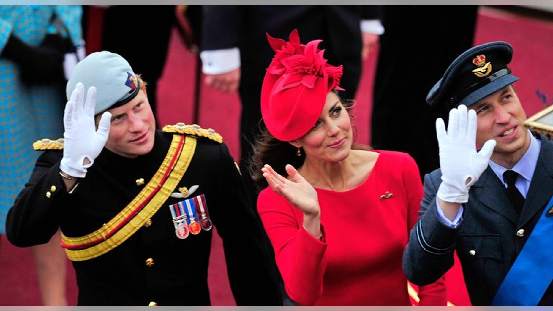 Britain's Catherine, Duchess of Cambridge, (C) Prince William (R) and Prince Harry (L) wave as they pass the Houses of Parliament in central London, on June 3, 2012. Prince Harry on Thursday promised to use his expertise to make sure his new nephew George "has fun".